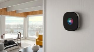 ecobee Smart Thermostat Premium with Siri on display installed on a wall