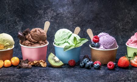 Ice cream scoops in cup with different flavors