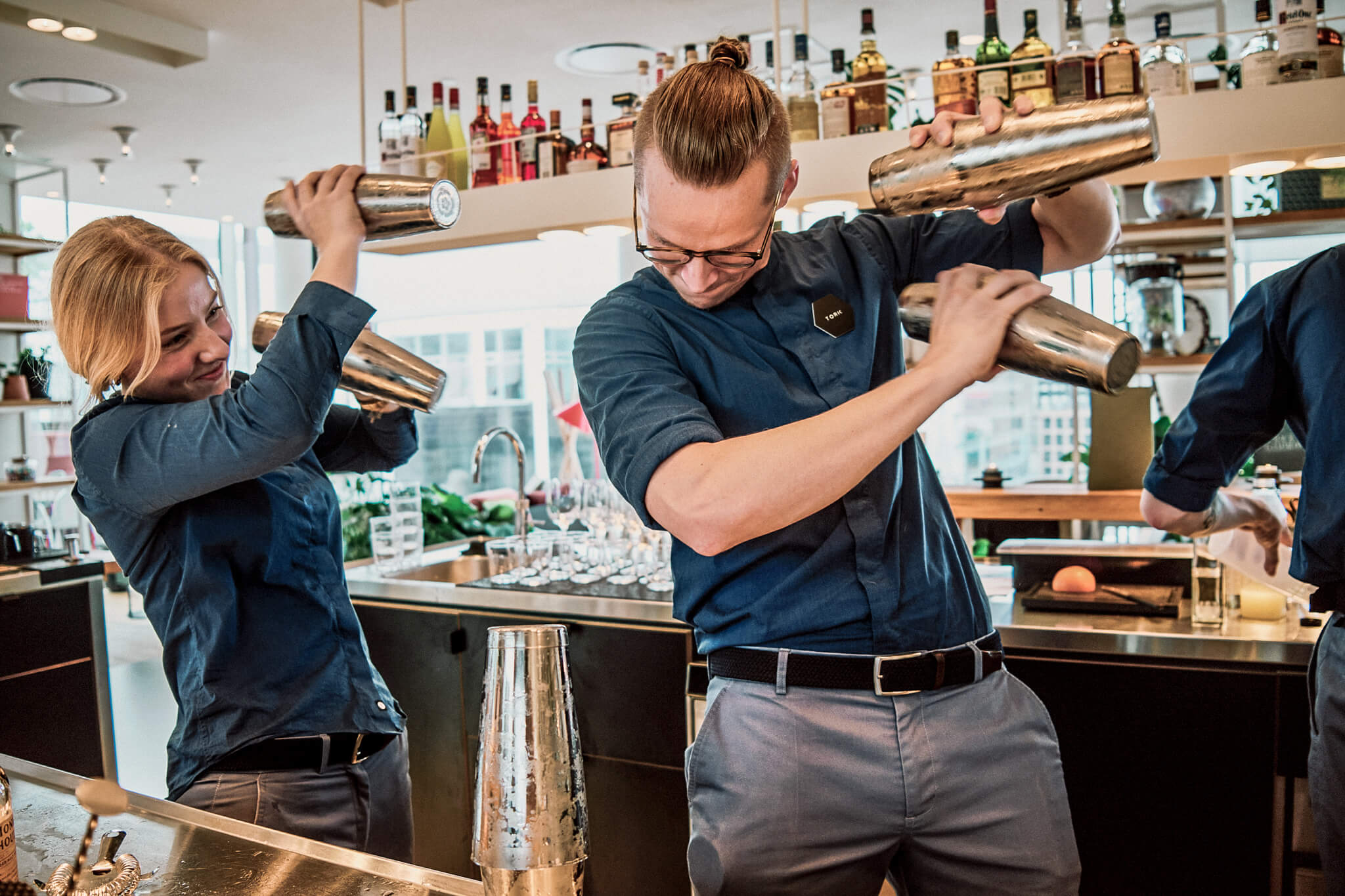 Skilled staff mixing Cocktails